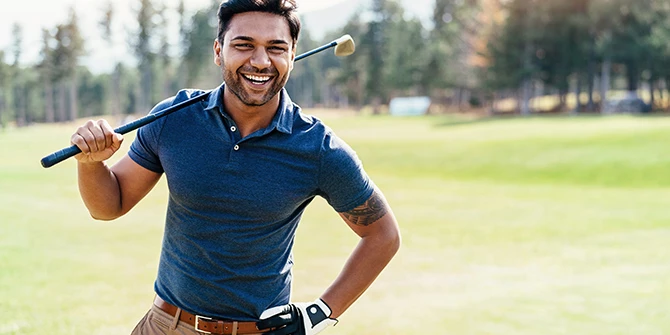 Golfer lining up a shot on the course